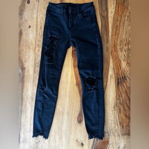 High rise black ripped jeans